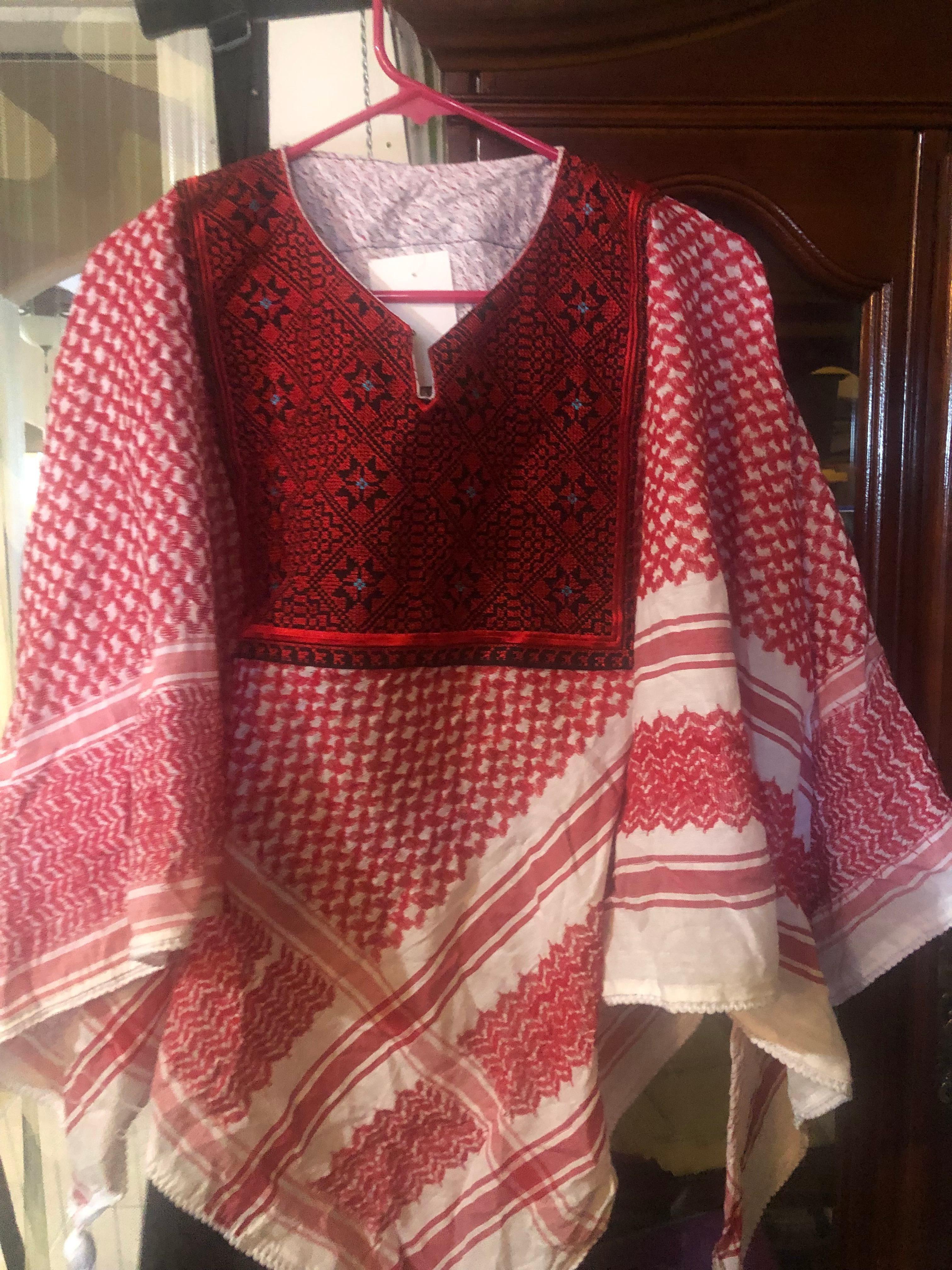 Red embroidered textile and kufiya pattern